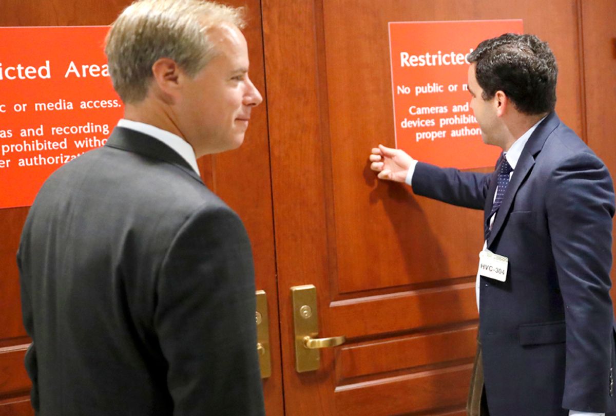 Twitter's Colin Crowell and Carlos Monje enter the closed door meeting with the House Intelligence Committee (AP/Alex Brandon)