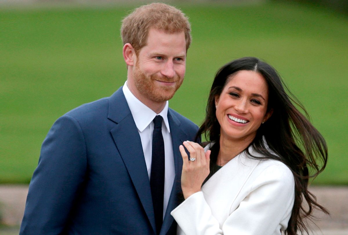 Prince Harry stands with his fiancée Meghan Markle as she shows off her engagement ring. (Getty/Daniel Leal-Olivas)