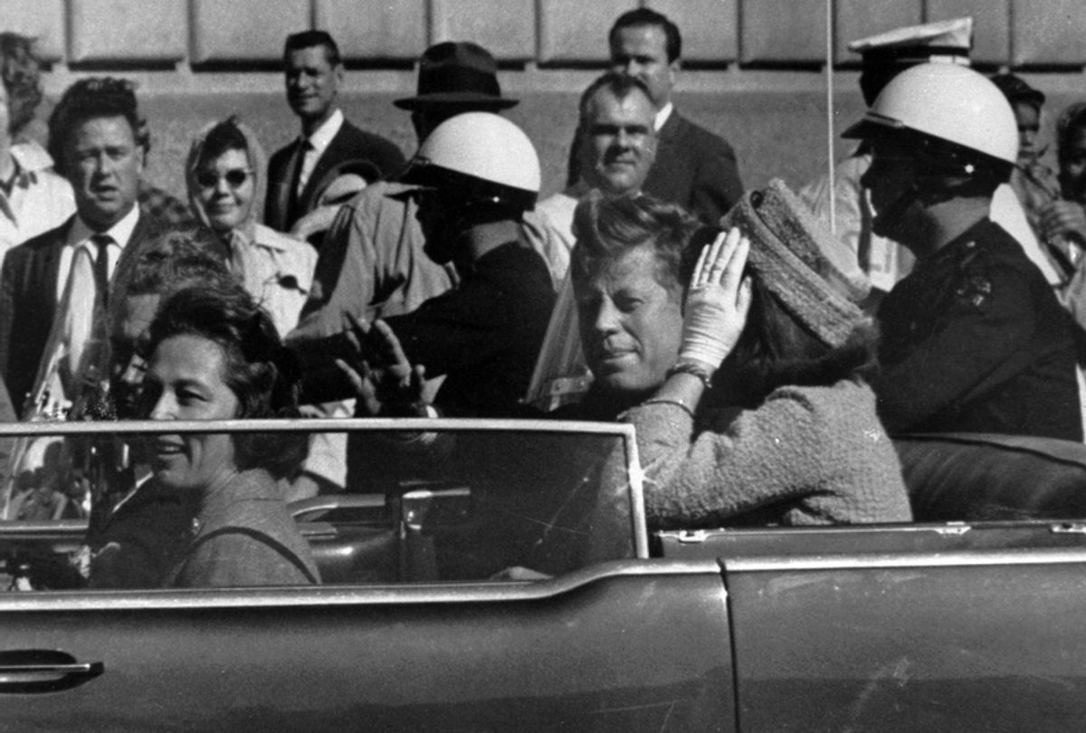 John F. Kennedy rides in the motorcade in Dallas, Texas., Nov. 22, 1963. (AP)