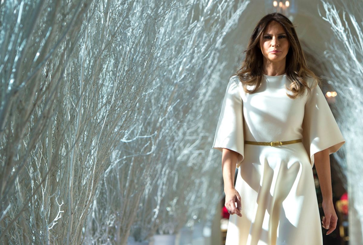 Melania Trump walks through Christmas decorations in the East Wing at the White House (Getty/Saul Loeb)
