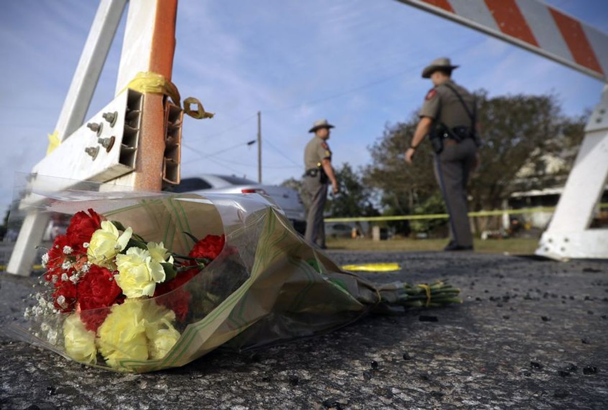 A bouquet of flowers lies at the base of a roadblock at the scene of the shooting at the First Baptist Church of Sutherland Springs, Nov. 6, 2017. (AP/Eric Gay)