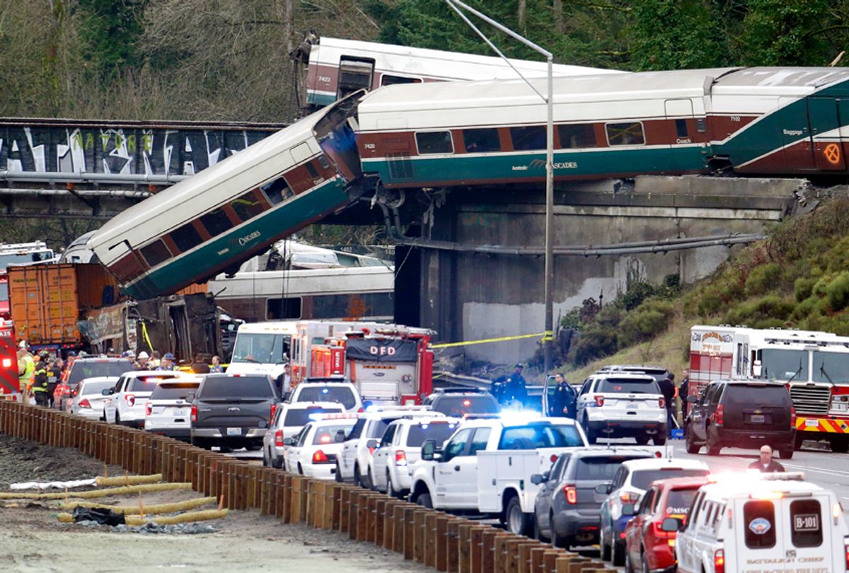 Cars from an Amtrak train lay spilled onto Interstate 5, in DuPont, Wash, Dec. 18, 2017. (AP/Elaine Thompson)