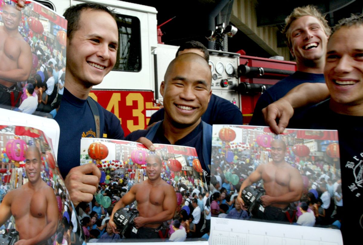 New York firefighters hold up the February photo for the FDNY's Calendar of Heroes (AP/Mary Altaffer)
