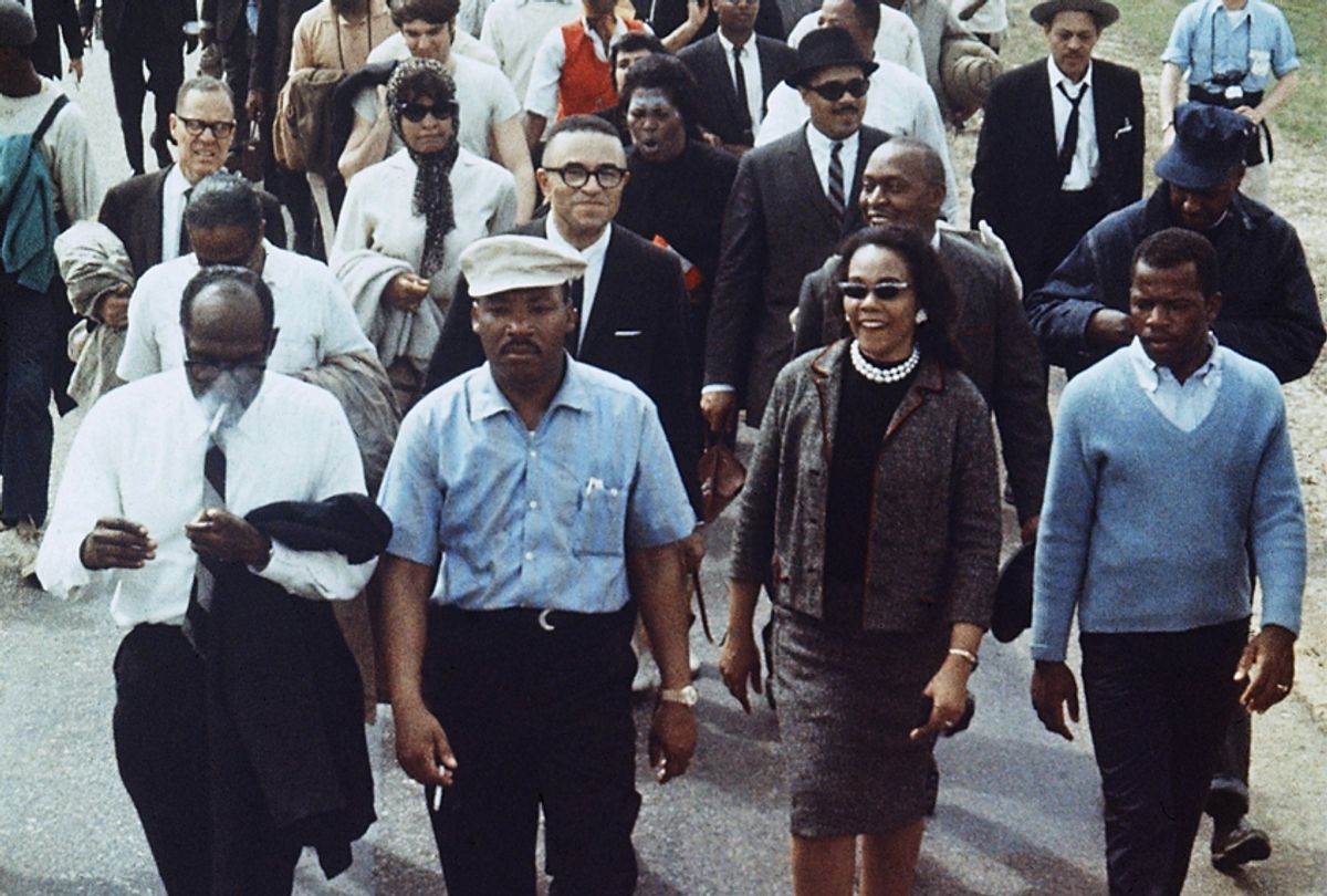 Martin Luther King Jr., his wife Coretta (right) and John Lewis (far right), lead a march from Selma to Montgomery, Alabama, March 1965 (AP)