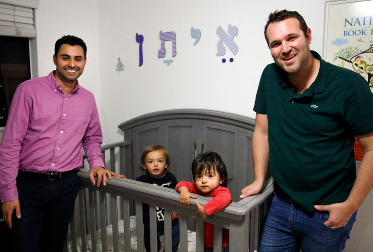 Elad Dvash-Banks, left, and his partner, Andrew, with their twin sons, Ethan, center right, and Aiden. (AP/Jae C. Hong)