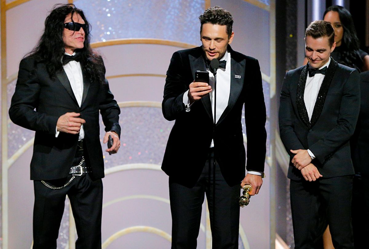 James Franco, with Tommy Wiseau and Dave Franco,  accepts the award for Best Performance by an Actor in a Motion Picture – Musical or Comedy for  “The Disaster Artist” during the 75th Annual Golden Globe Awards January 7, 2018 (Getty/Paul Drinkwater)