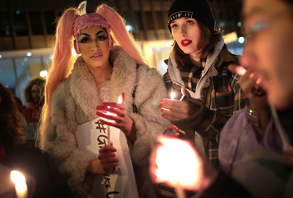 Demonstrators protest for transgender rights and hold a candlelight vigil to remember transgender friends lost to murder and suicide (Getty/Scott Olson)