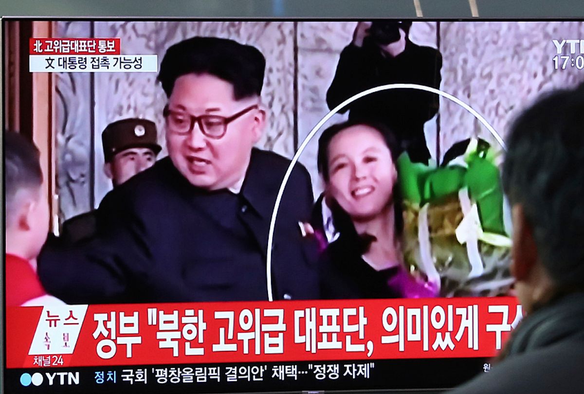 People watch a TV screen showing Kim Jong Un and his sister Kim Yo Jong (AP/Ahn Young-joon)