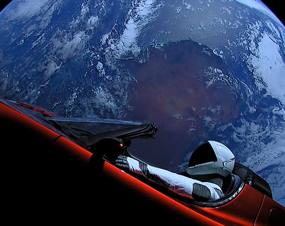 A Tesla roadster launched from the Falcon Heavy rocket with a dummy driver named "Starman"  heads towards Mars. (Gett/SpaceX)