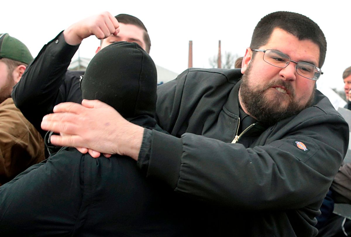 White nationalist Matthew Heimbach fights with demonstrators at Michigan State University as he and other alt-right advocates try to attend a speech by white nationalist Richard Spencer, March 5, 2018. (Getty/Scott Olson)