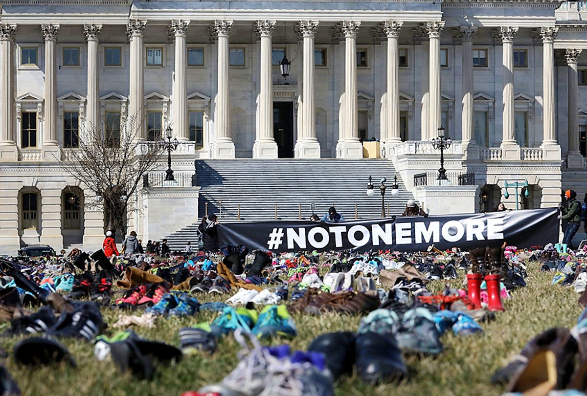 Seven thousand pairs of shoes, representing the children killed by gun violence since the mass shooting at Sandy Hook Elementary School in 2012, are spread out on the lawn on the east side of the U.S. Capitol, March 13, 2018 (Getty/Chip Somodevilla)