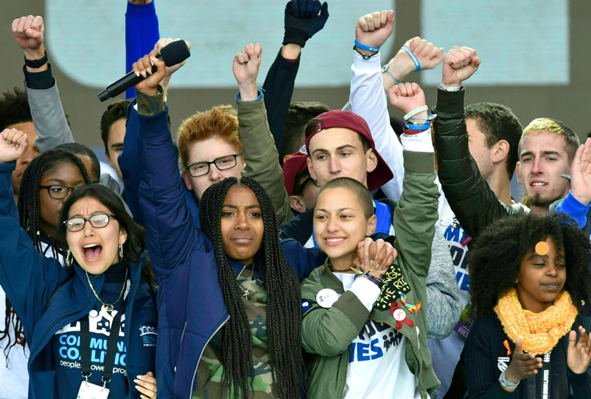 Marjory Stoneman Douglas High School student Emma Gonzalez gathers with other students on stage during the March for Our Lives Rally in Washington, DC on March 24, 2018.  (Getty/Nicholas Kamm)