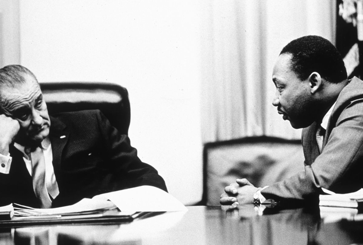President Lyndon B Johnson discusses the Voting Rights Act with civil rights campaigner Martin Luther King Jr. (Getty/Hulton Archive)