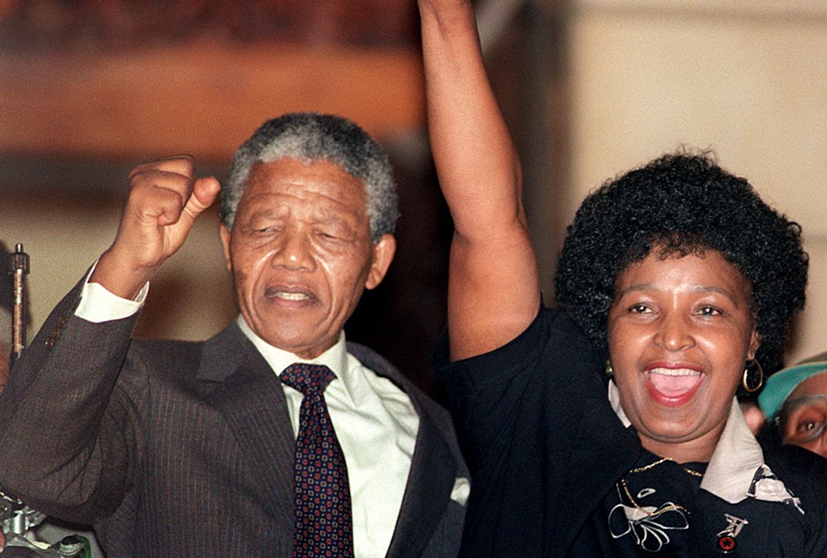Nelson Mandela and Winnie Mandela cheering crowd upon Mandela's release from Victor Verster prison. (Getty/Walter Dhladhla)