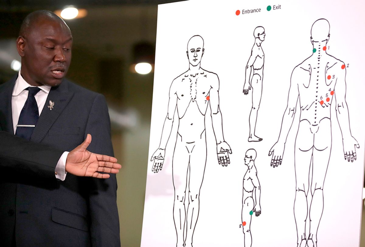 Attorney Ben Crump looks at a diagram showing gunshot wounds to Stephon Clark during a news conference at the Southside Christian Center on March 30, 2018 in Sacramento, California. (Getty/Justin Sullivan)