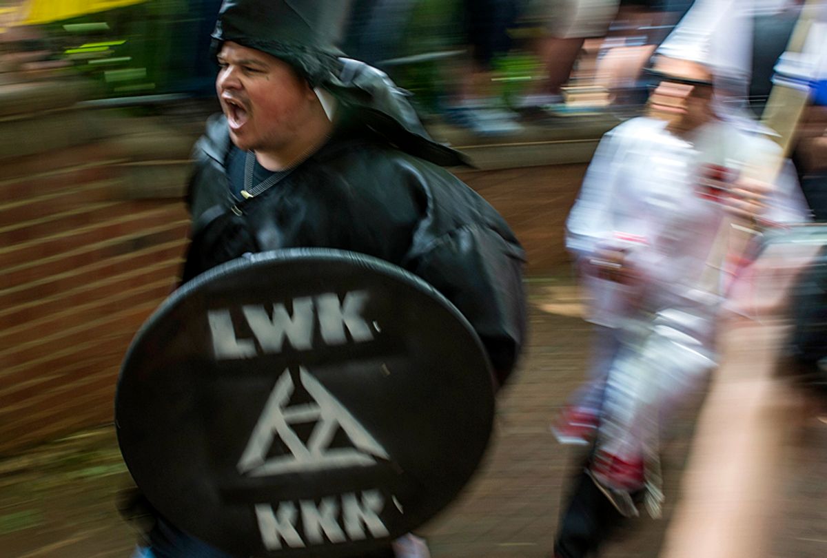 Members of the Ku Klux Klan at a rally to protect Southern Confederate monuments (Getty/Andrew Caballero)