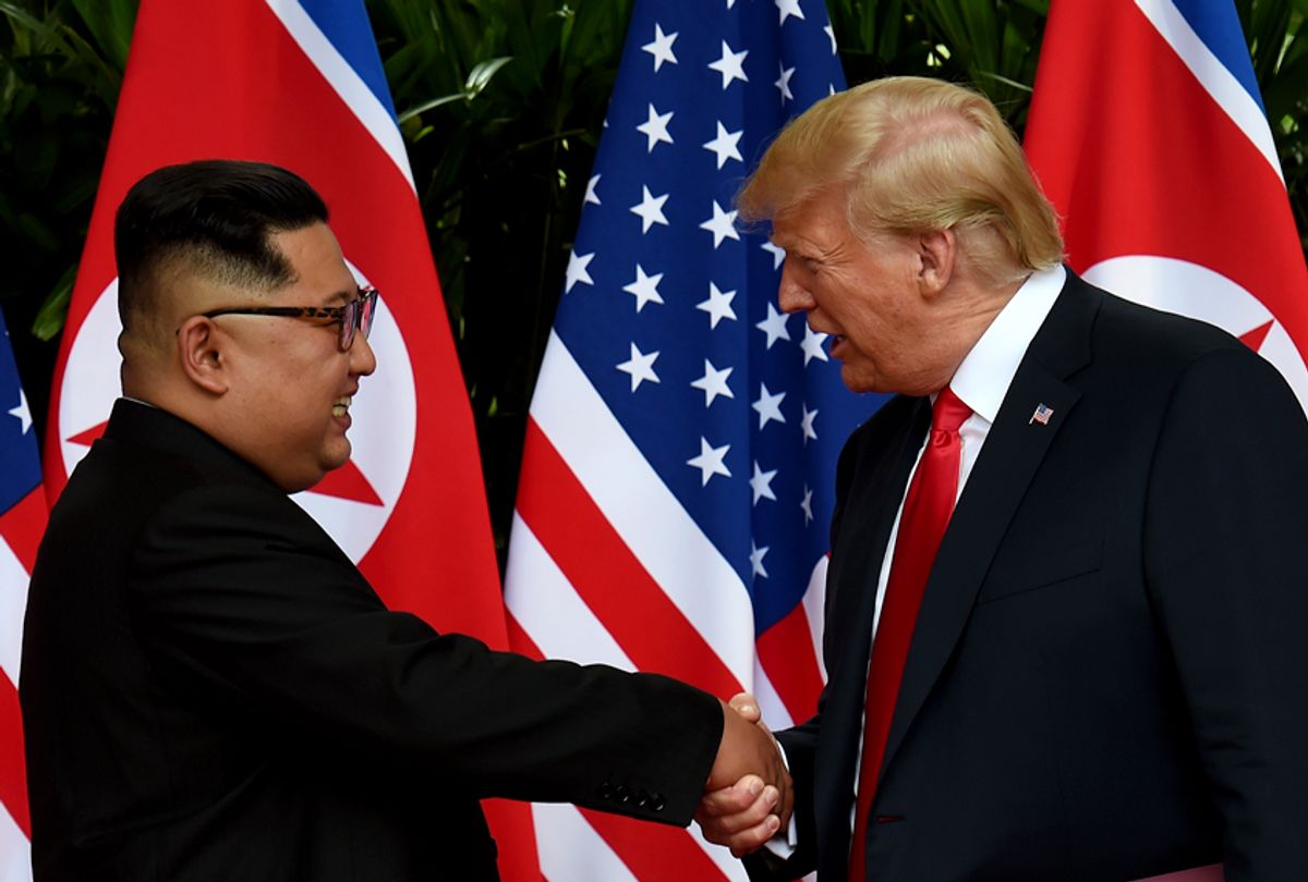 Kim Jong Un shakes hands with Donald Trump after taking part in a signing ceremony at the US-North Korea summit, June 12, 2018. (Getty/Anthony Wallace)