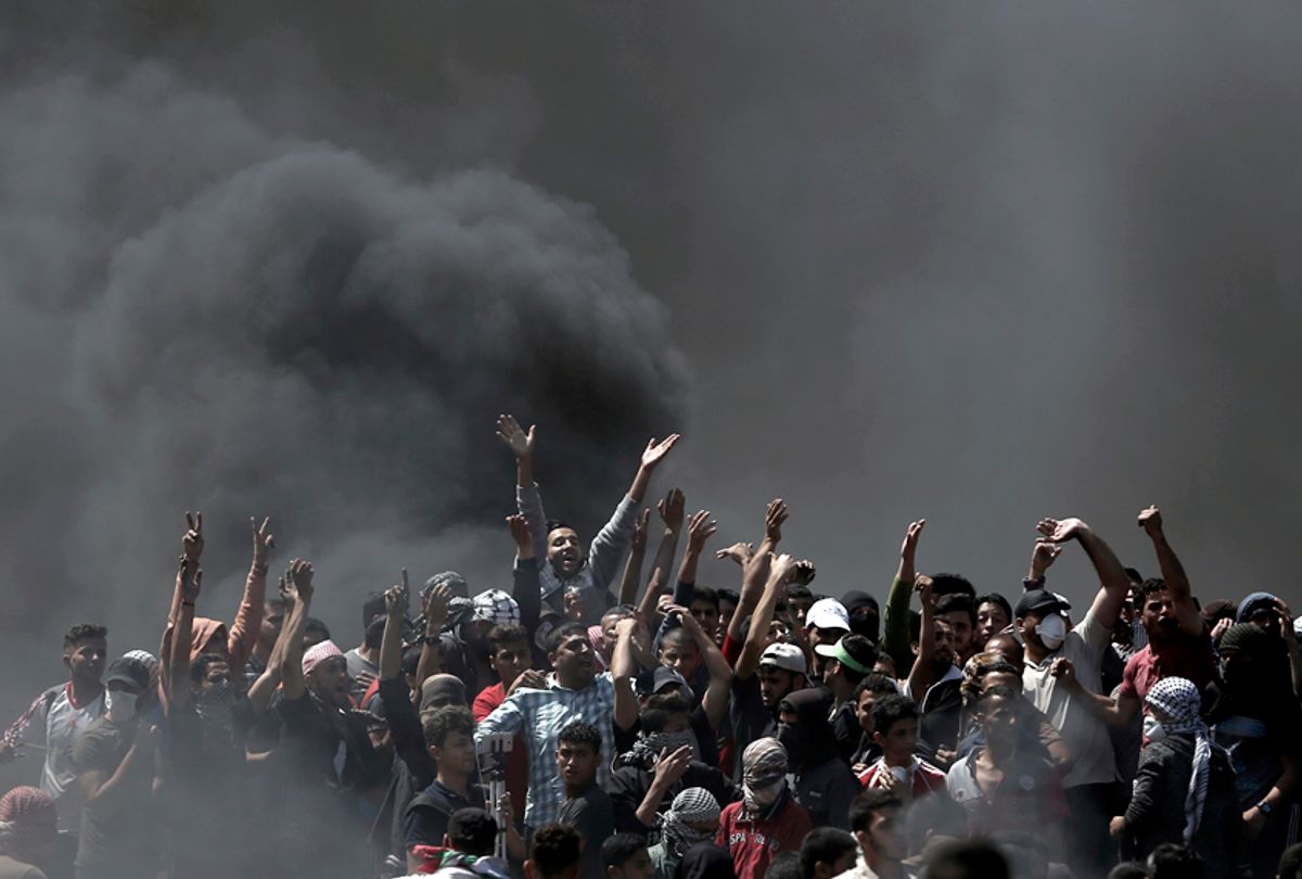 Palestinian protesters protest on the Gaza Strip's border with Israel. (AP/Khalil Hamra)
