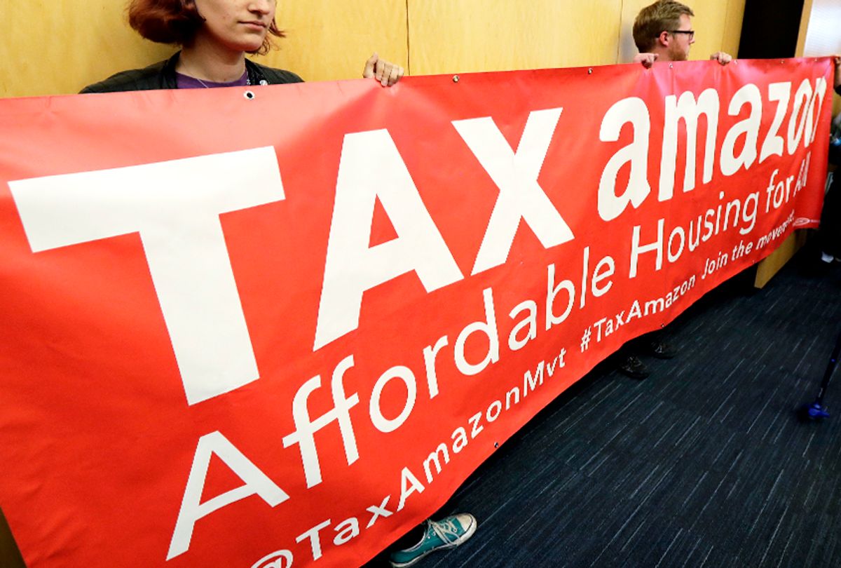 Demonstrators opposing the repeal of a tax on large companies such as Amazon and Starbucks in Seattle. (AP/Ted S. Warren)