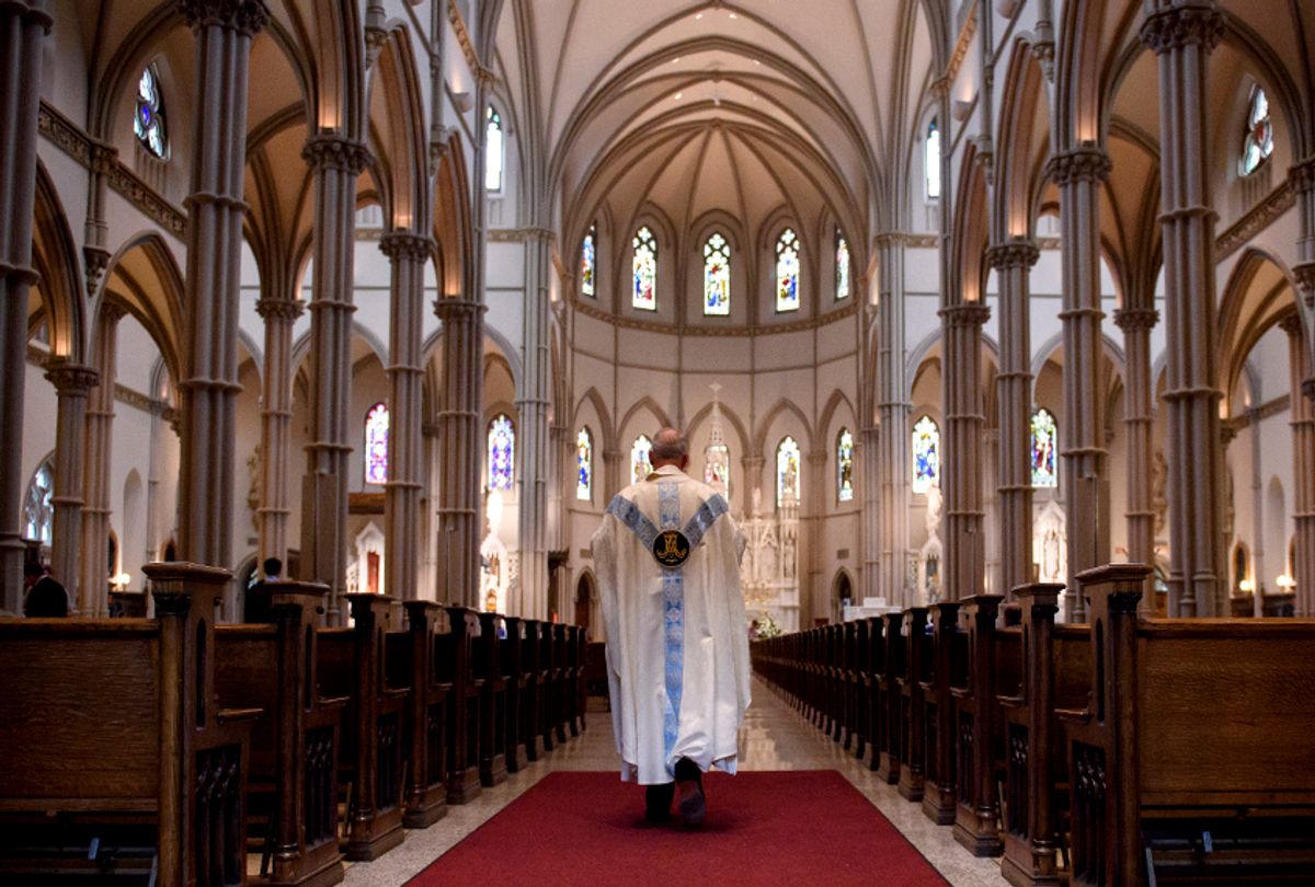 Father Kris Stubna walks to the sanctuary following a mass to celebrate the Assumption of the Blessed Virgin Mary at St Paul Cathedral, the mother church of the Pittsburgh Diocese on August 15, 2018 in Pittsburgh. (Getty/Jeff Swensen)