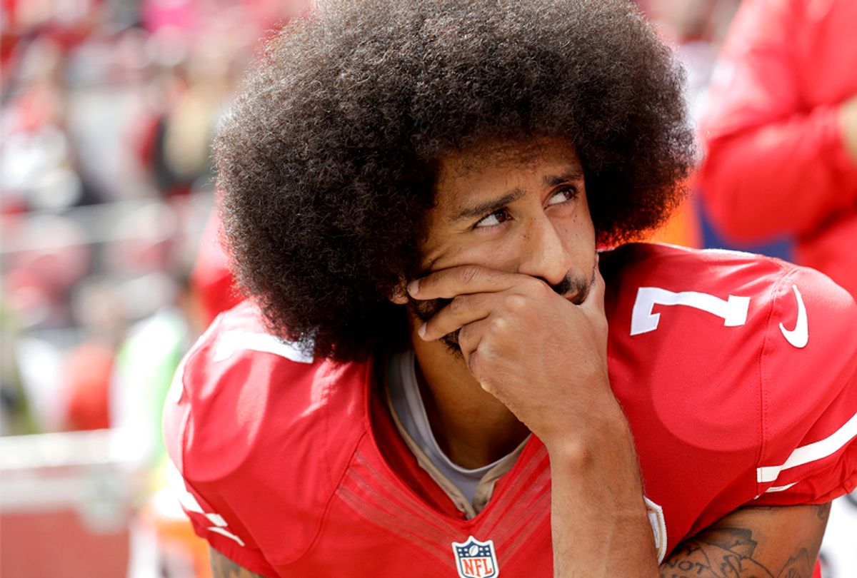Colin Kaepernick kneels during the national anthem before an NFL football game. (AP/Marcio Jose Sanchez))