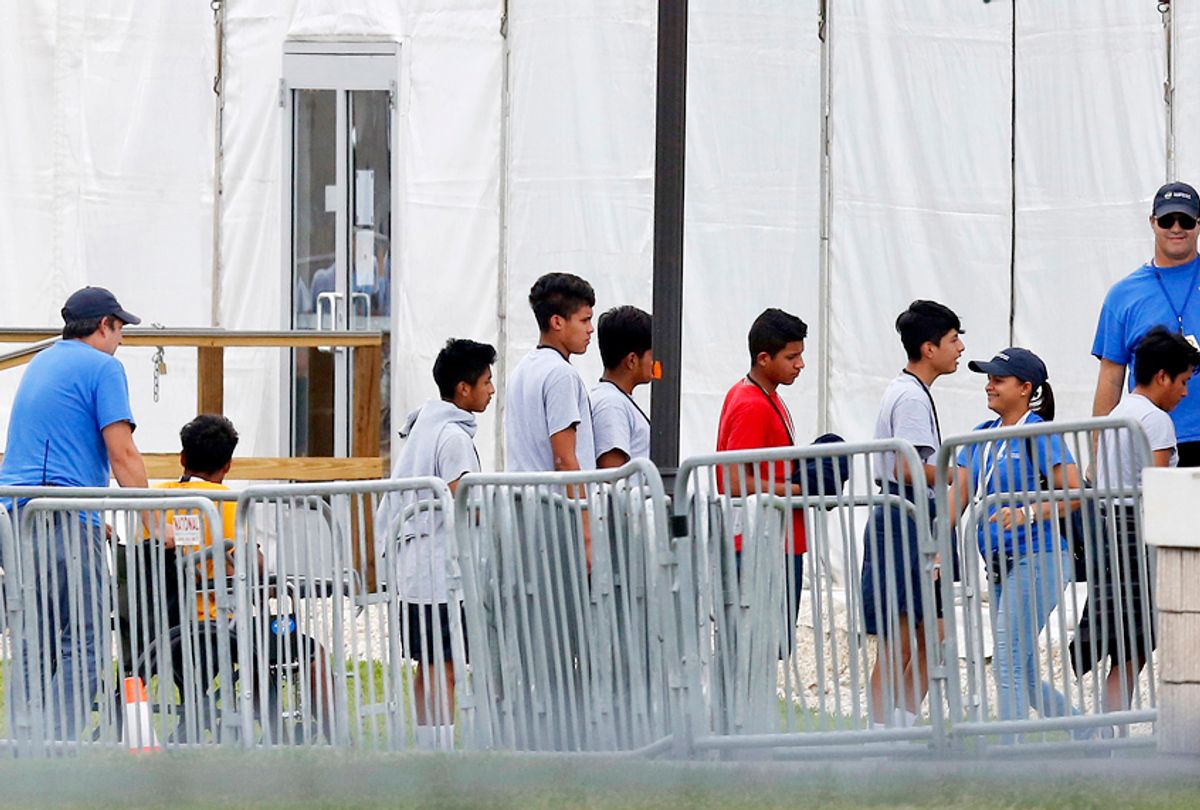 Immigrant children walk in outside the Homestead Temporary Shelter for Unaccompanied Children in Homestead, Fla. (AP/Brynn Anderson)