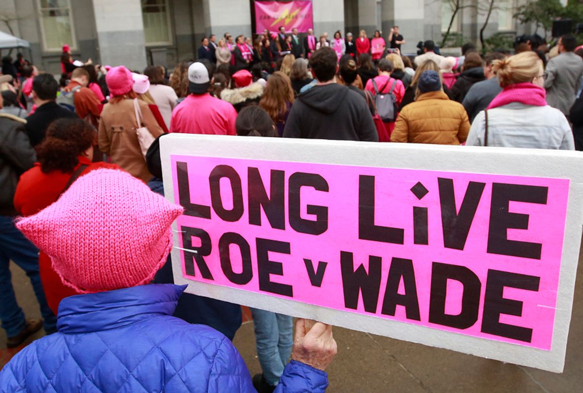 Supporters attend a rally held by Planned Parenthood, commemorating the 45th anniversary of the Roe vs. Wade Supreme Court ruling. (AP/Rich Pedroncelli)