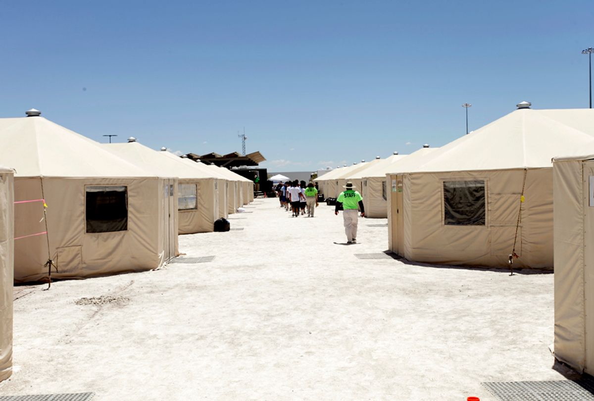 The undated photo released by U.S. Department of Health and Human Services shows detainees walking in a line at the HHS' unaccompanied alien children program facility at Tornillo, Texas. (AP/U.S. Department of Health and Human Services)