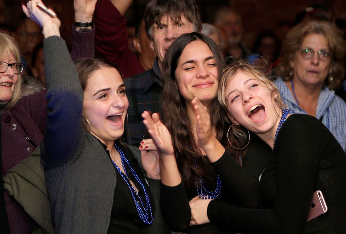 People celebrate as they watch election results at a democratic watch party for Democratic congressional candidate Antonio Delgado in Kingston, N.Y., Tuesday, Nov. 6, 2018. (AP/Seth Wenig)