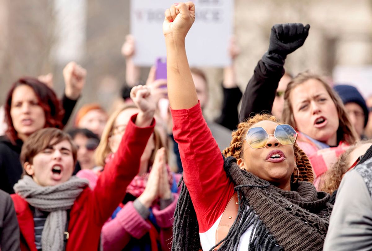 Participants listen to a speaker during the Women's March for Truth on January 20, 2018 in St Louis, Missouri. (Getty/Whitney Curtis)
