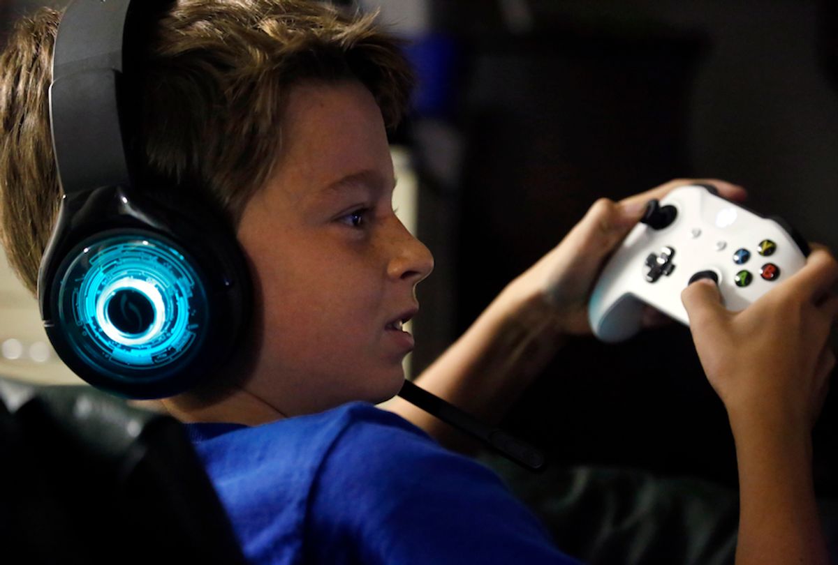 Henry Hailey, age 10, plays one of the online Fortnite games in the early morning hours of Saturday, Oct. 6, 2018, in the basement of his Chicago home. His parents are on a quest to limit screen time for him and his brother. The boys say they understand sometimes -- but also complain that they get less screen time than their friends. (AP Photo/Martha Irvine) (AP)