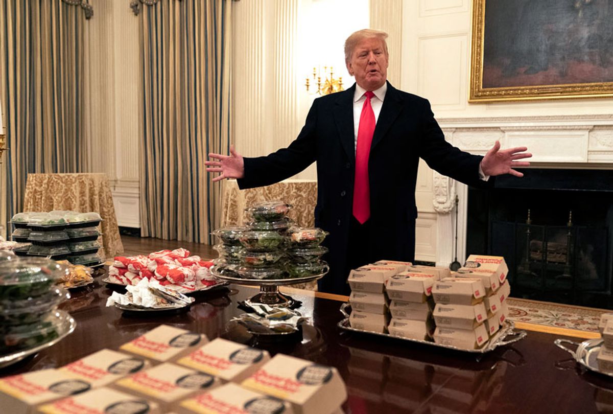 Donald Trump presents fast food to be served to the Clemson Tigers football team to celebrate their Championship at the White House on January 14, 2019 in Washington, DC. (Getty/Chris Kleponis)