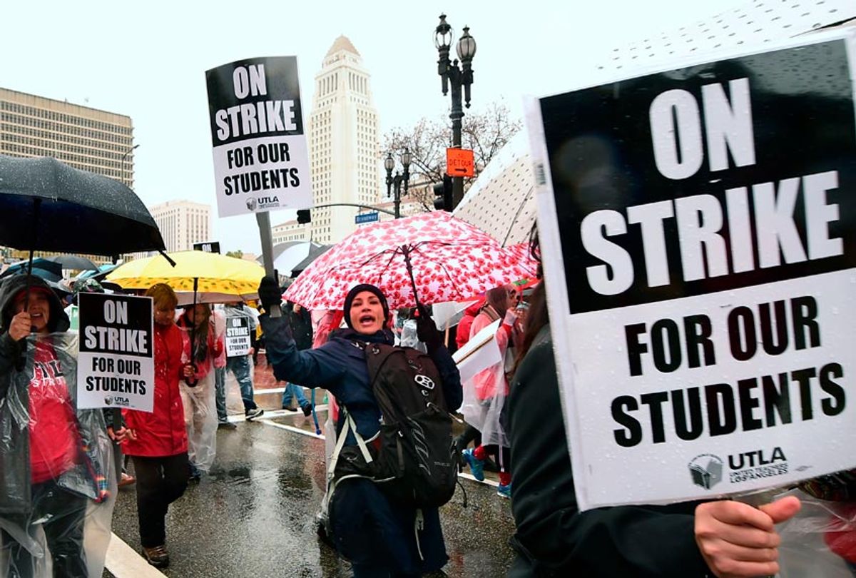 Thousands of teachers march in the rain through Los Angeles, California on January 14, 2019, on the first day of the first teachers strike in 30 years targeting the Los Angeles Unified School District (LAUSD). (Getty/Frederic J. Brown)