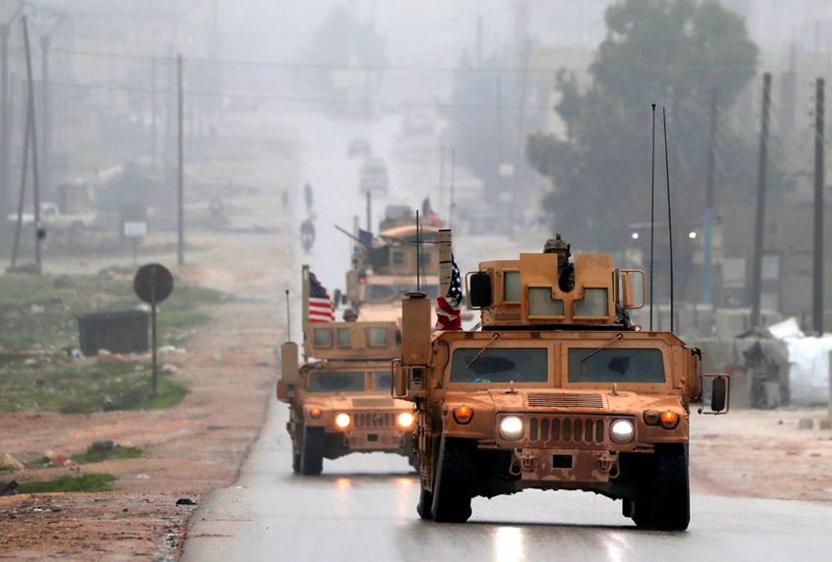 A picture taken on December 30, 2018, shows a line of US military vehicles in Syria's northern city of Manbij. (Getty/Delil Souleiman)