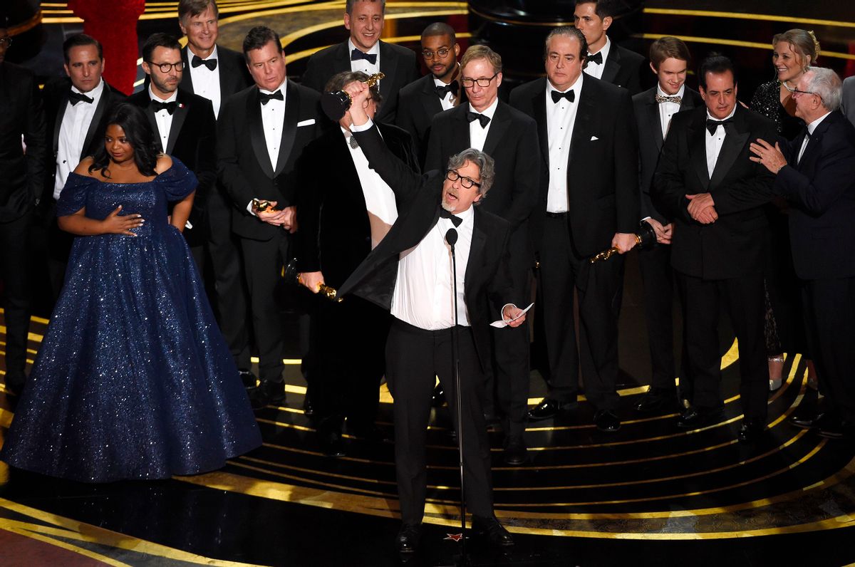 Peter Farrelly, center, and the cast and crew of “Green Book” accept the award for best picture at the Oscars. (Chris Pizzello/Invision/AP)
