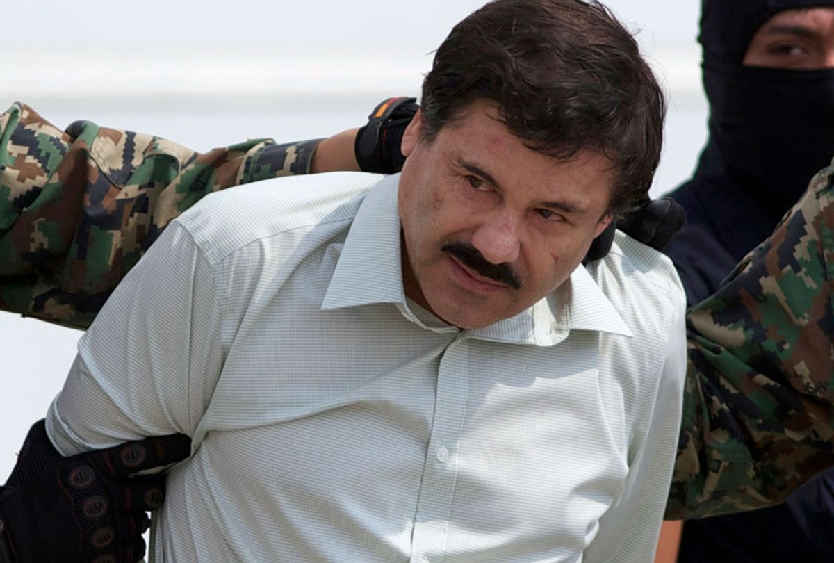 This Feb. 22, 2014 file photo shows Joaquin "El Chapo" Guzman, the head of Mexico's Sinaloa Cartel, being escorted to a helicopter in Mexico City. (AP/Eduardo Verdugo)