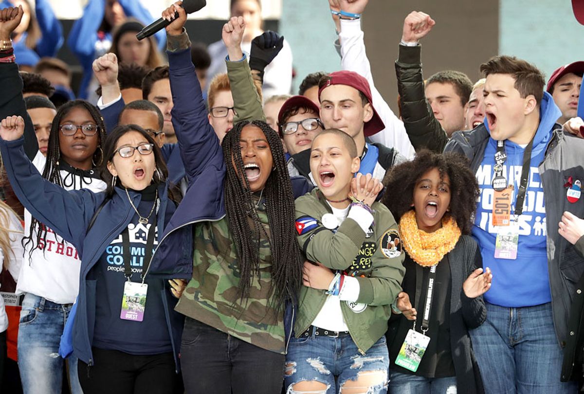 Students from Marjory Stoneman Douglas High School, including Emma Gonzalez (C), stand together on stage with other young victims of gun violence at the conclusion of the March for Our Lives rally on March 24, 2018 in Washington, DC. (Getty/Chip Somodevilla)