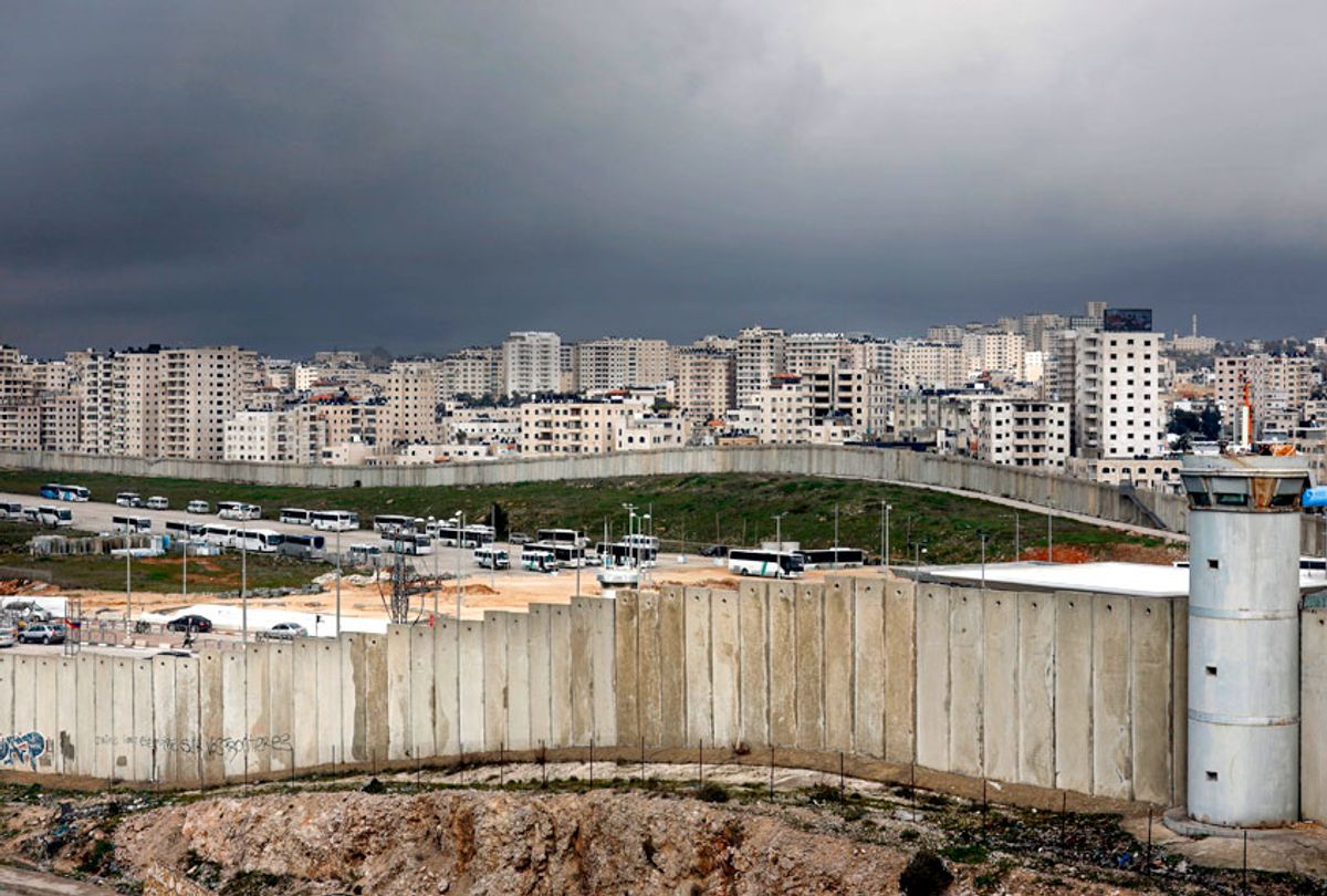 This picture taken on January 17, 2019 from the Palestinian West Bank village of Al-Ram shows the controversial Israeli separation barrier separating East Jerusalem  and the Palestinian West Bank town of Qalandia. (Getty/Thomas Coex)
