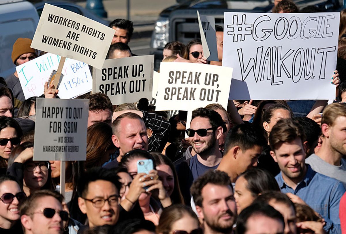 Google employees hold up signs during a walkout rally at Harry Bridges Plaza, Thursday, Nov. 1, 2018, in San Francisco. (AP/Eric Risberg)