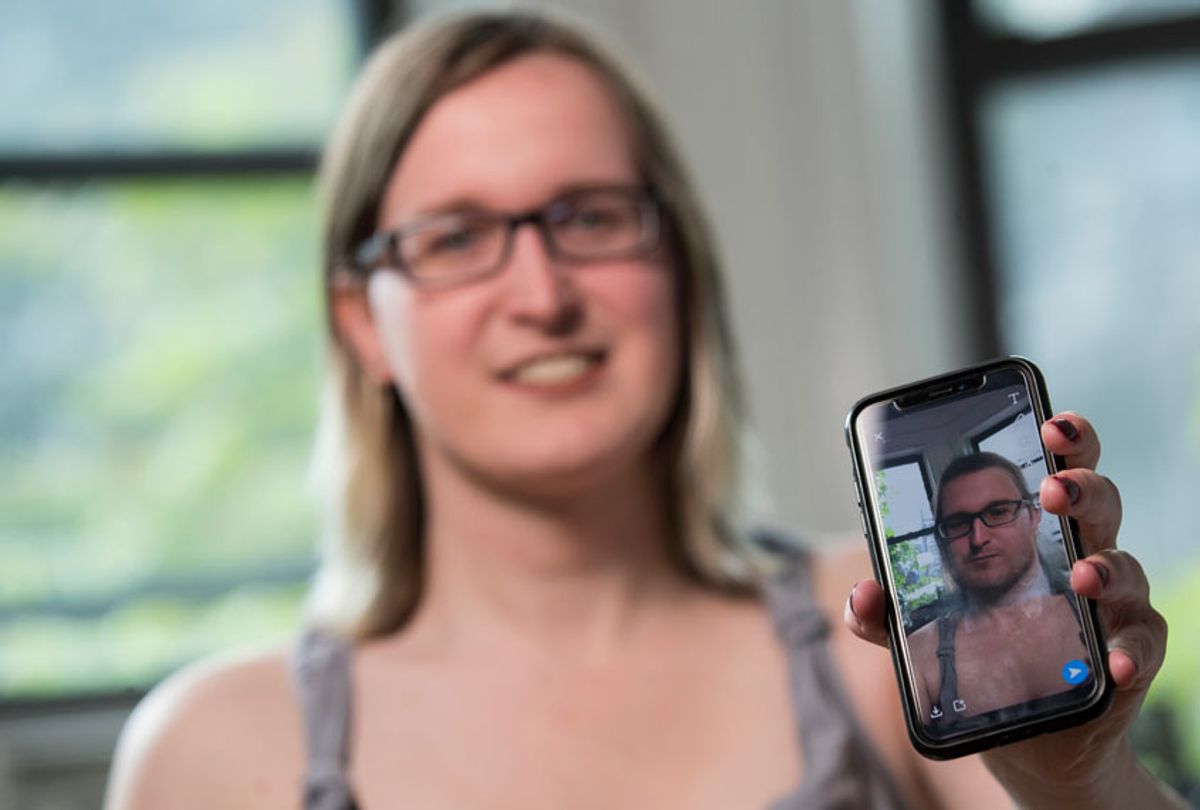 In this Wednesday, May 15, 2019, photo, Bailey Coffman shows her photo as a man in the Snapchat app during an interview in New York. (AP/Mary Altaffer)