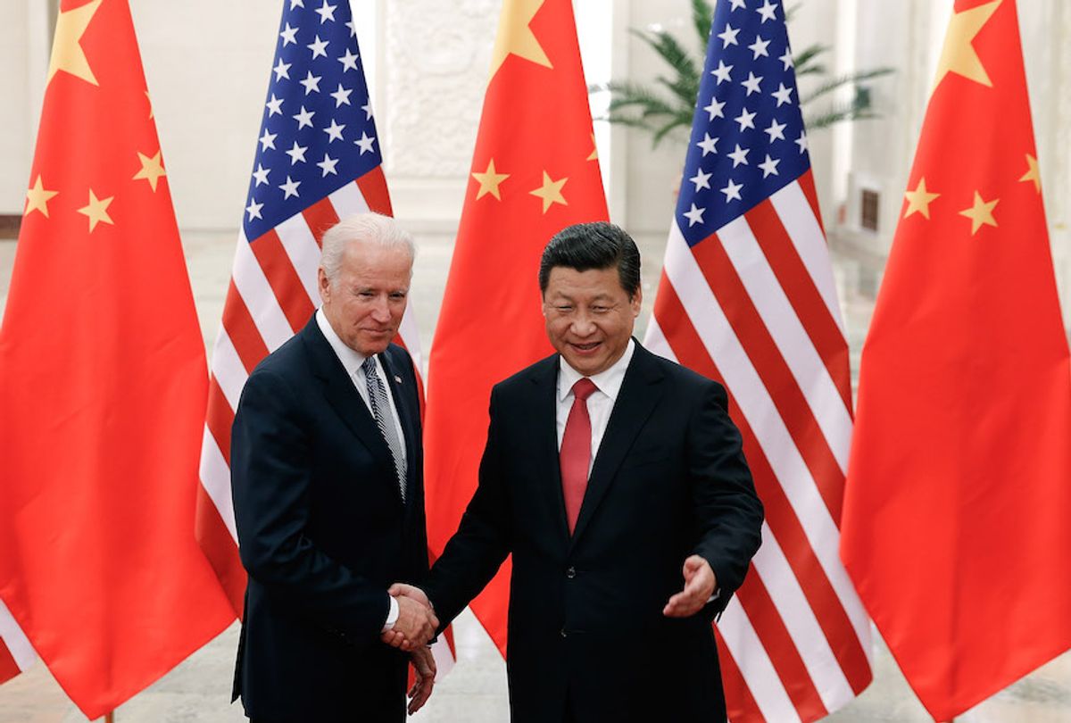Chinese President Xi Jinping (R) shake hands with U.S Vice President Joe Biden (L) inside the Great Hall of the People on December 4, 2013 in Beijing, China.  (Lintao Zhang/Getty Images)