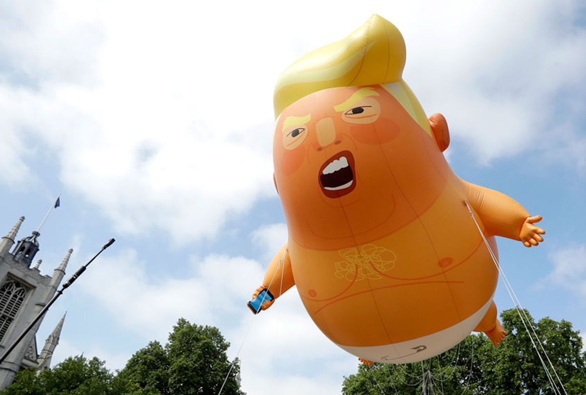 A six-meter high cartoon baby blimp of U.S. President Donald Trump is flown as a protest against his visit, in Parliament Square in London, England, Friday, July 13, 2018 (AP/Matt Dunham)