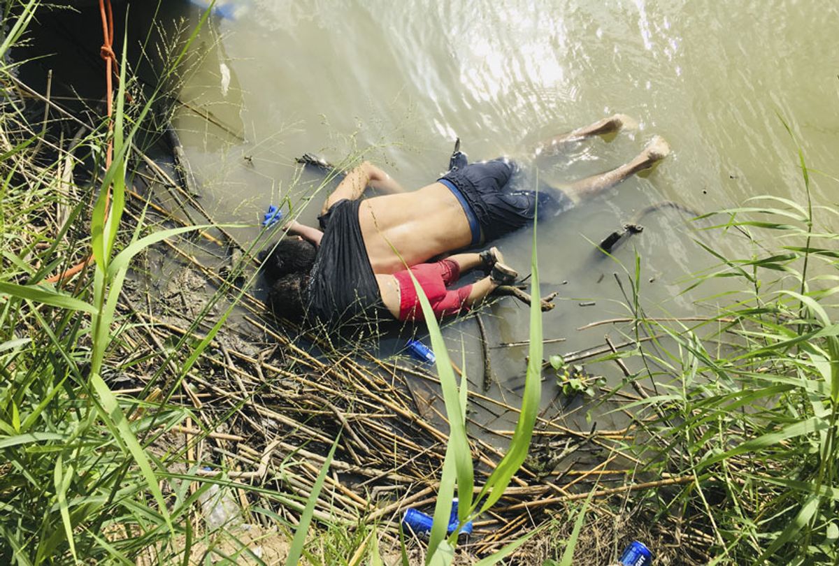 The bodies of Salvadoran migrant Oscar Alberto Martínez Ramírez and his nearly 2-year-old daughter Valeria lie on the bank of the Rio Grande in Matamoros, Mexico, Monday, June 24, 2019, after they drowned trying to cross the river to Brownsville, Texas. (AP/Julia Le Duc)