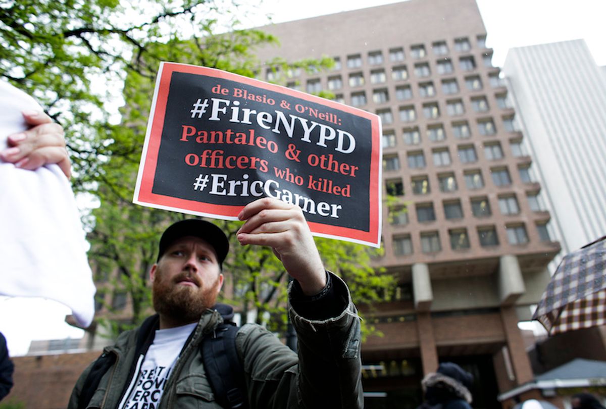 People protest outside the police headquarters while a disciplinary hearing takes place for officer Daniel Pantaleo on May 13, 2019 in New York City. - Pantaleo faces charges of reckless use of a chokehold and intentional restriction of breathing, on the Eric Garner death case. (Photo by Kena Betancur / AFP)        (Photo credit should read KENA BETANCUR/AFP/Getty Images) (Kena Betancur/Getty Images)