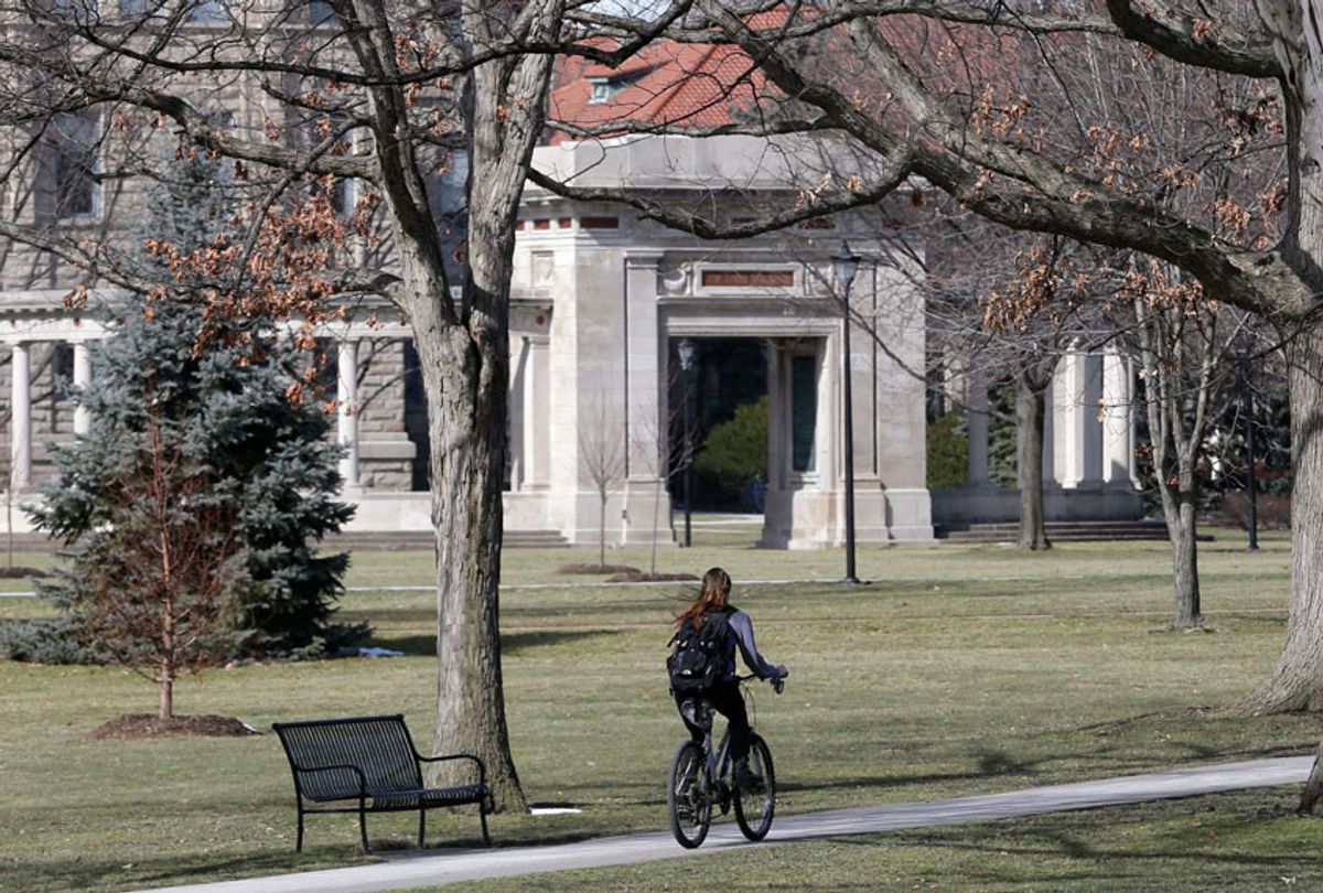 A student riding a bicycle on the campus of Oberlin College in Oberlin, Ohio (AP/Tony Dejak)
