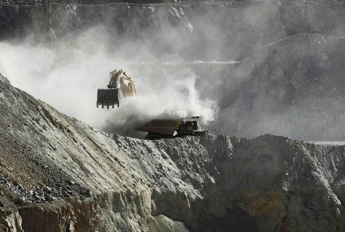 In this Sept. 25, 2012 photo, a bulldozer works at the Chuquicamata copper mine in the Atacama desert in northern Chile.  (AP Photo/Jorge Saenz)
