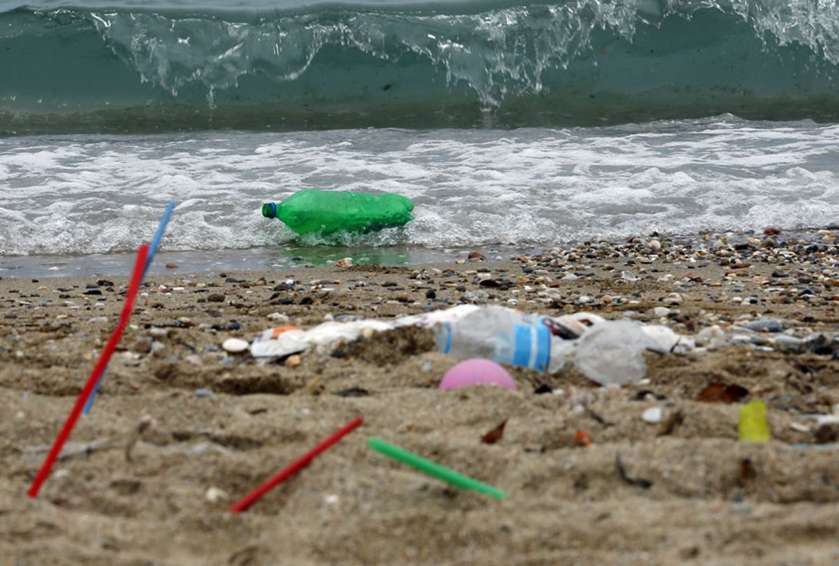 Plastic garbage lying on the Aegean sea beach near Athens on June 26, 2018 , Greece. (Getty/Milos Bicanski)