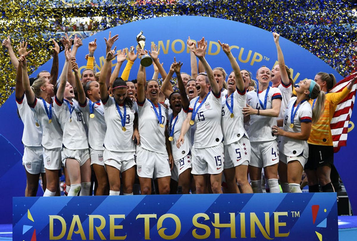 USA's players celebrate with the trophy after the France 2019 Womens World Cup football final match between USA and the Netherlands, on July 7, 2019, at the Lyon Stadium in Lyon, central-eastern France. (Getty/FRANCK FIFE)