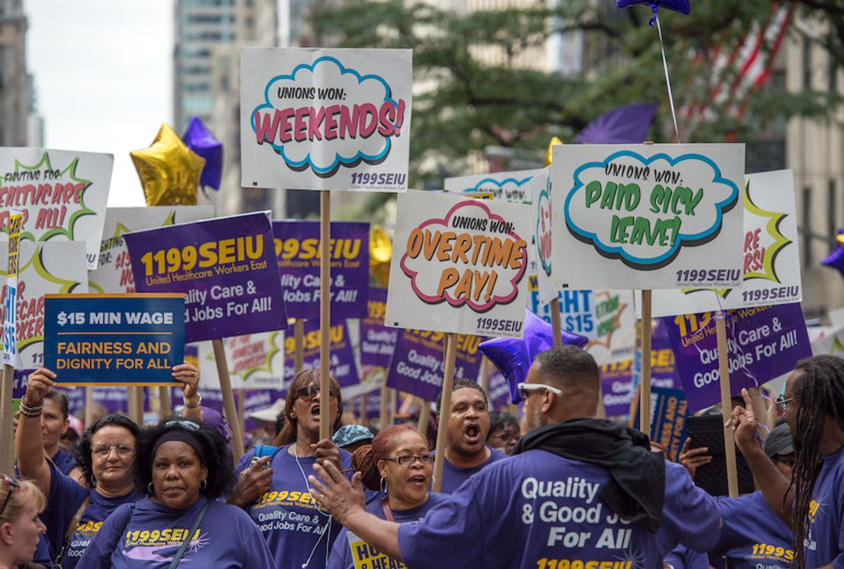 Members of 1199 Service Employees International Union march up Fifth Avenue in the annual Labor Day Parade in New York, Saturday Sept. 12, 2015. (AP Photo/Bryan R. Smith) (AP Photo/Bryan R. Smith)