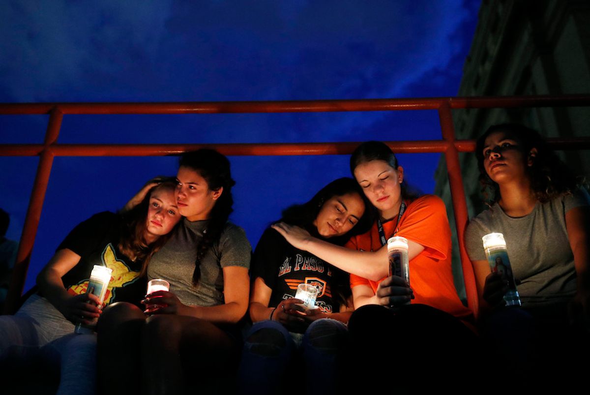 From left, Melody Stout, Hannah Payan, Aaliyah Alba, Sherie Gramlich and Laura Barrios comfort each other during a vigil for victims of the shooting Saturday, Aug. 3, 2019, in El Paso, Texas.  (AP/John Locher)